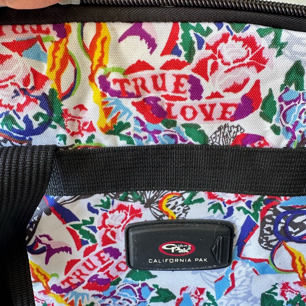Vibrant Red and Blue Travel Bag with Dynamic Artistic Flair